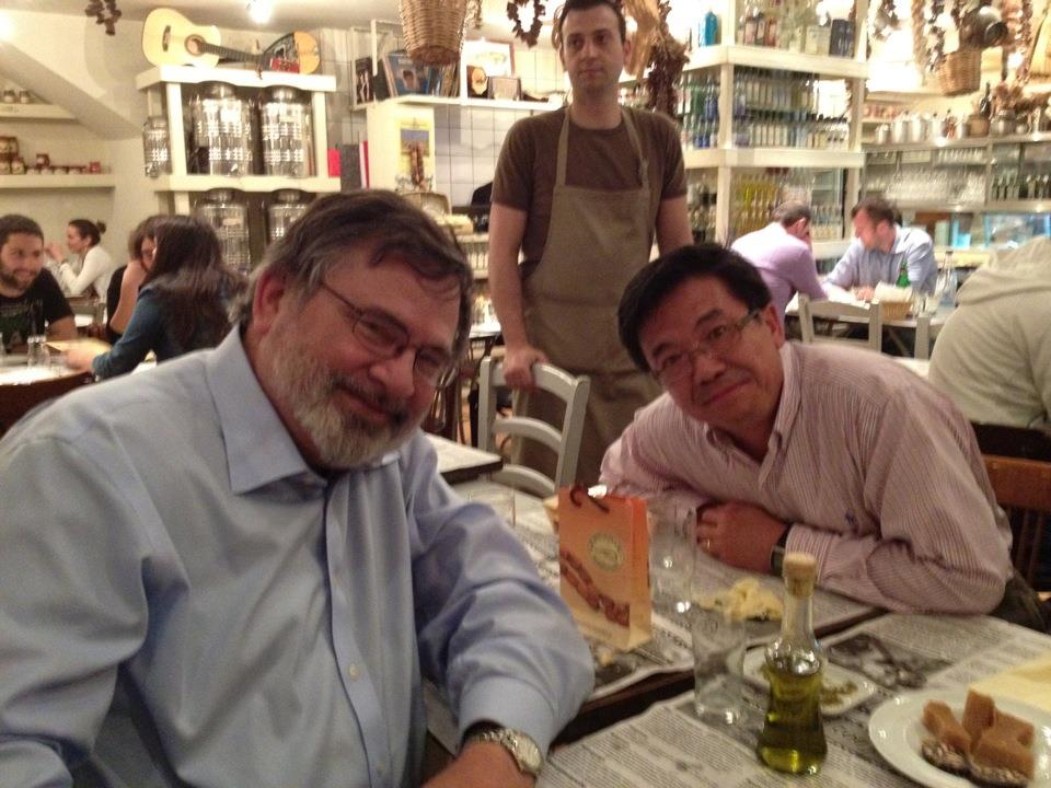 Robert Olin and Luoheng Han seated at a table